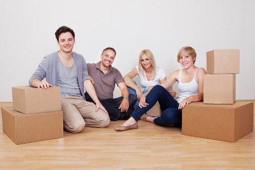 Experienced mover securing items in a London van